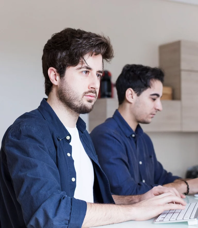 two white flower pot and notepad kept on a white table